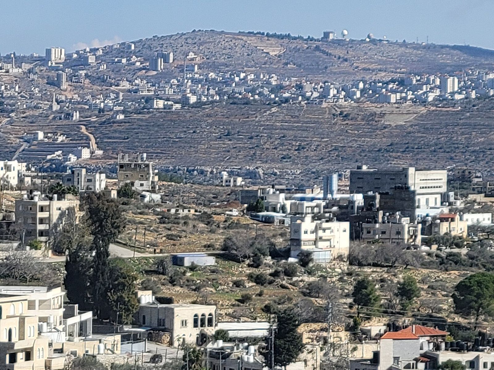 Terraced hillsides and houses looking east from Birzeit